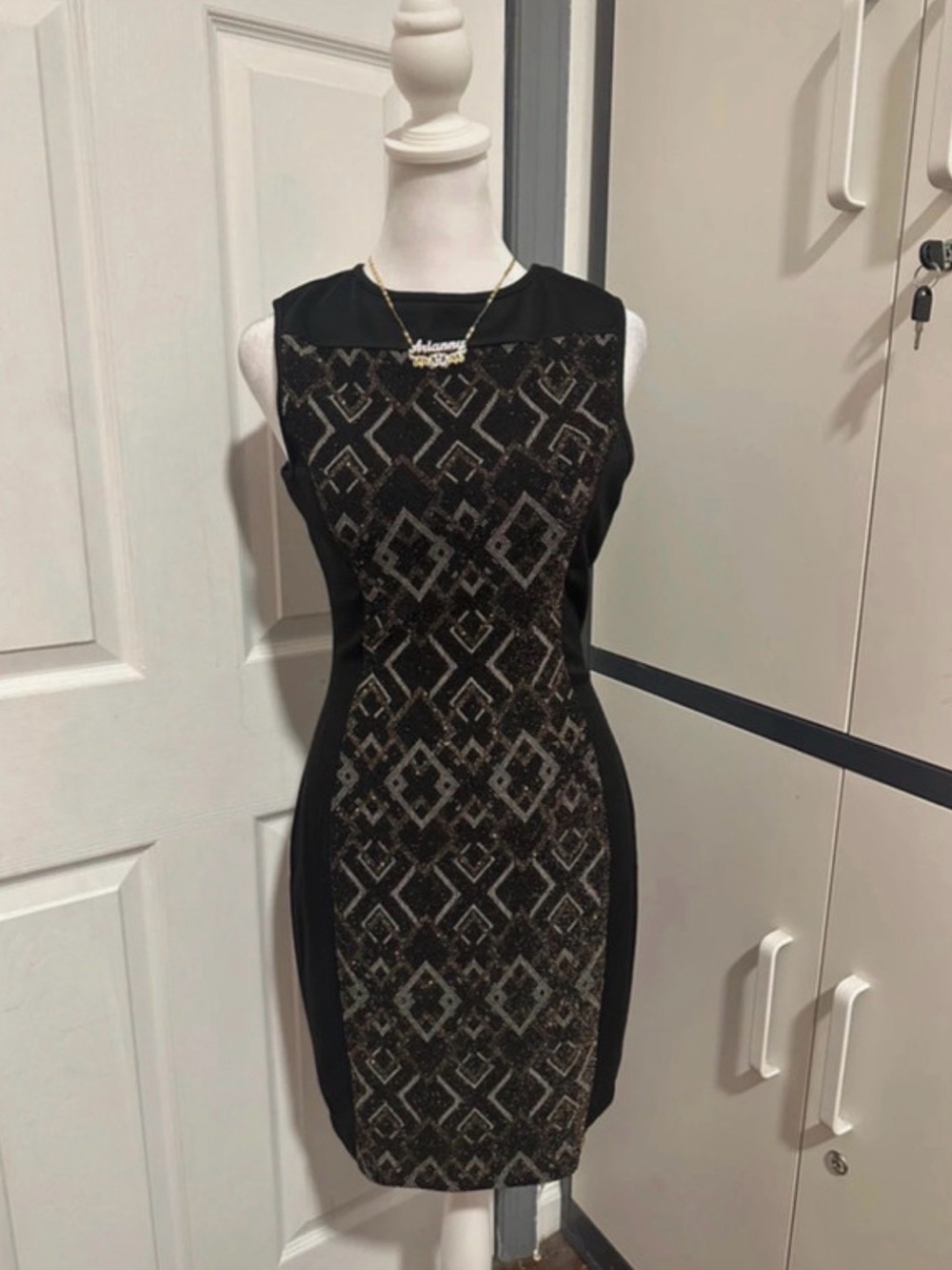 Sleeveless Black Mini Dress with Metallic Geometric Panel